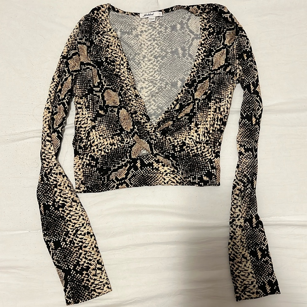 Subdued criss cross top